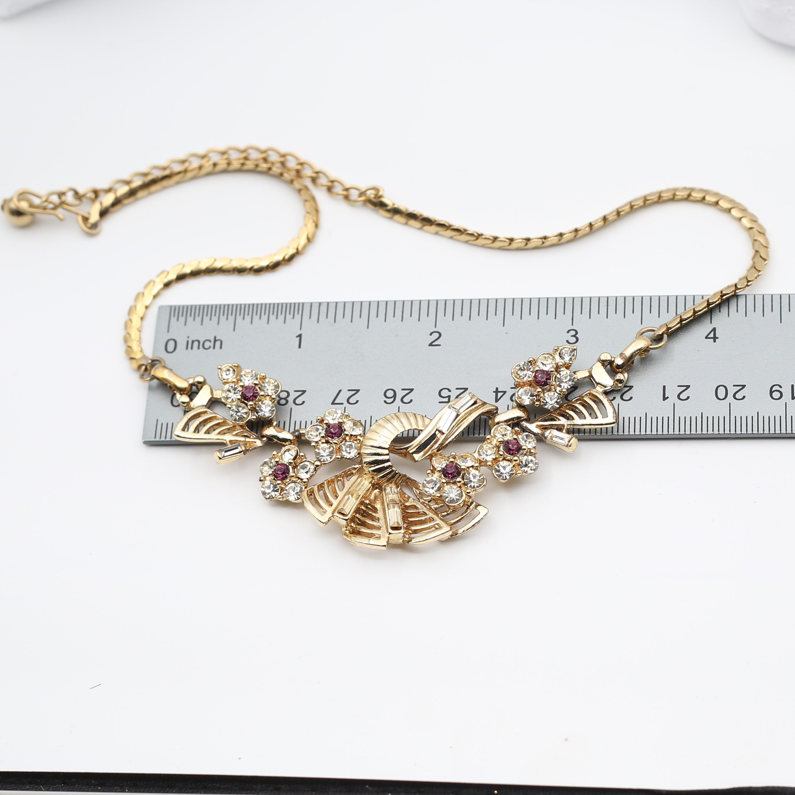 Intricate gold-plated necklace with rhinestones